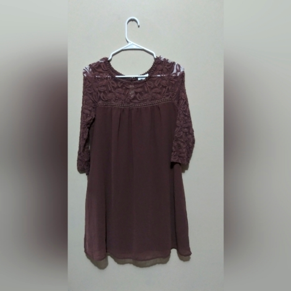 A.U.W brown shirt and the size is  Medium